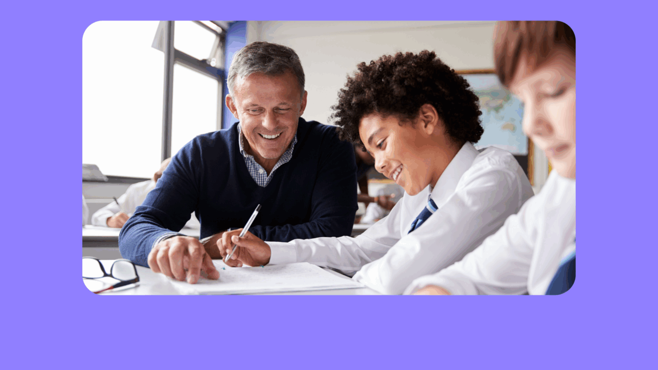 Video cover image of a teacher helping a student with their schoolwork in a classroom